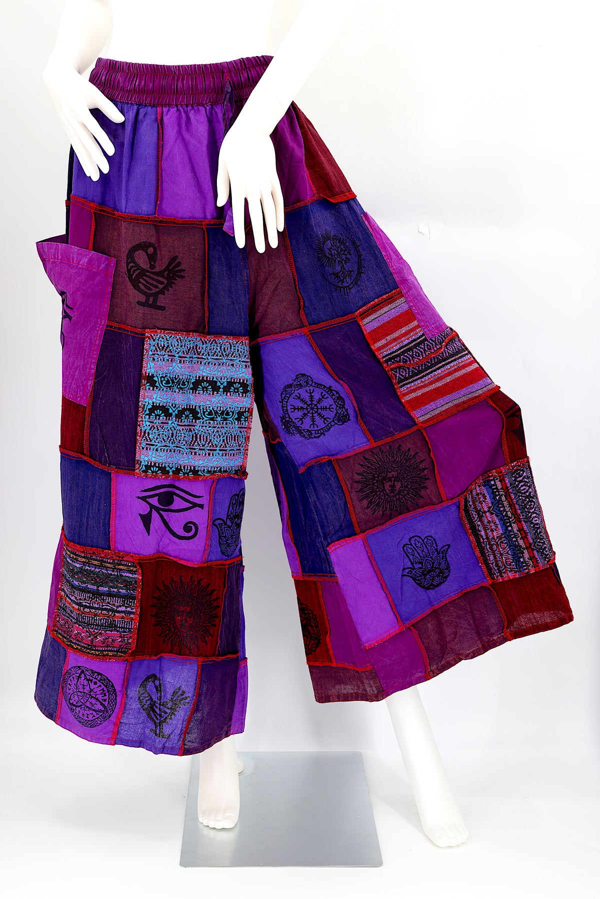 Bohemian harem pants with Old Gods symbolic patchwork and wide-leg design, handmade from natural cotton