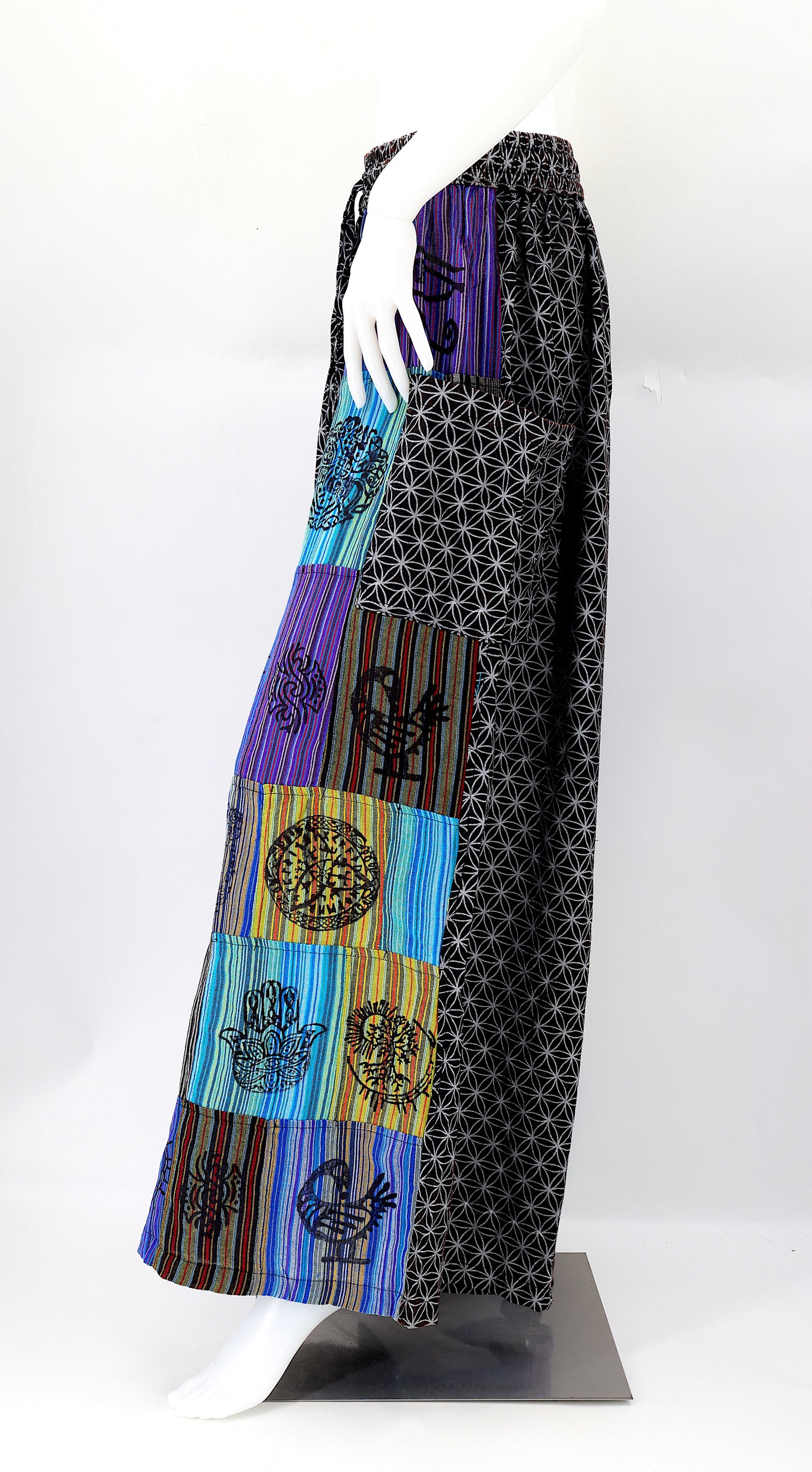 Side view showing adjustable waistband and large pockets on handmade bohemian wide-leg pants