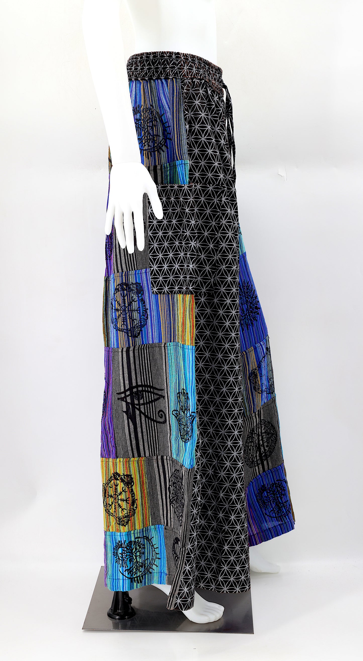Side view showing adjustable waistband and large pockets on handmade bohemian wide-leg pants