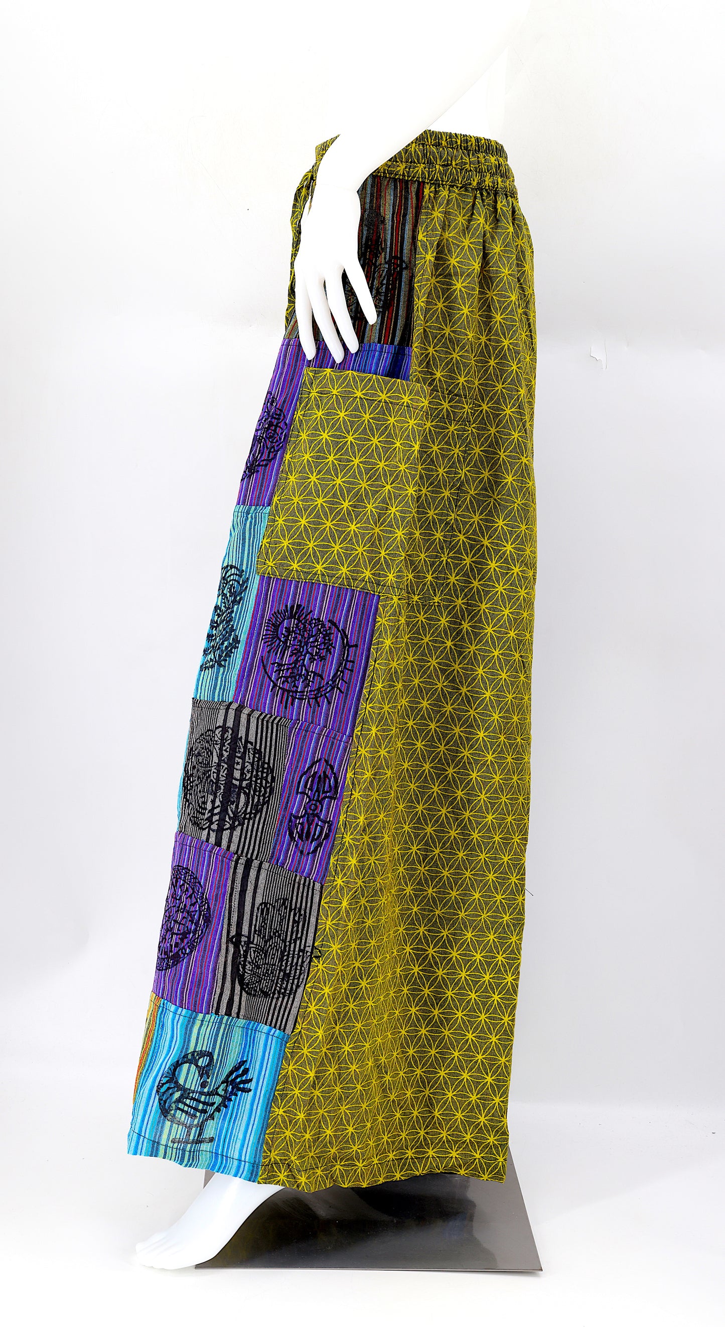Side view showing adjustable waistband and large pockets on handmade bohemian wide-leg pants