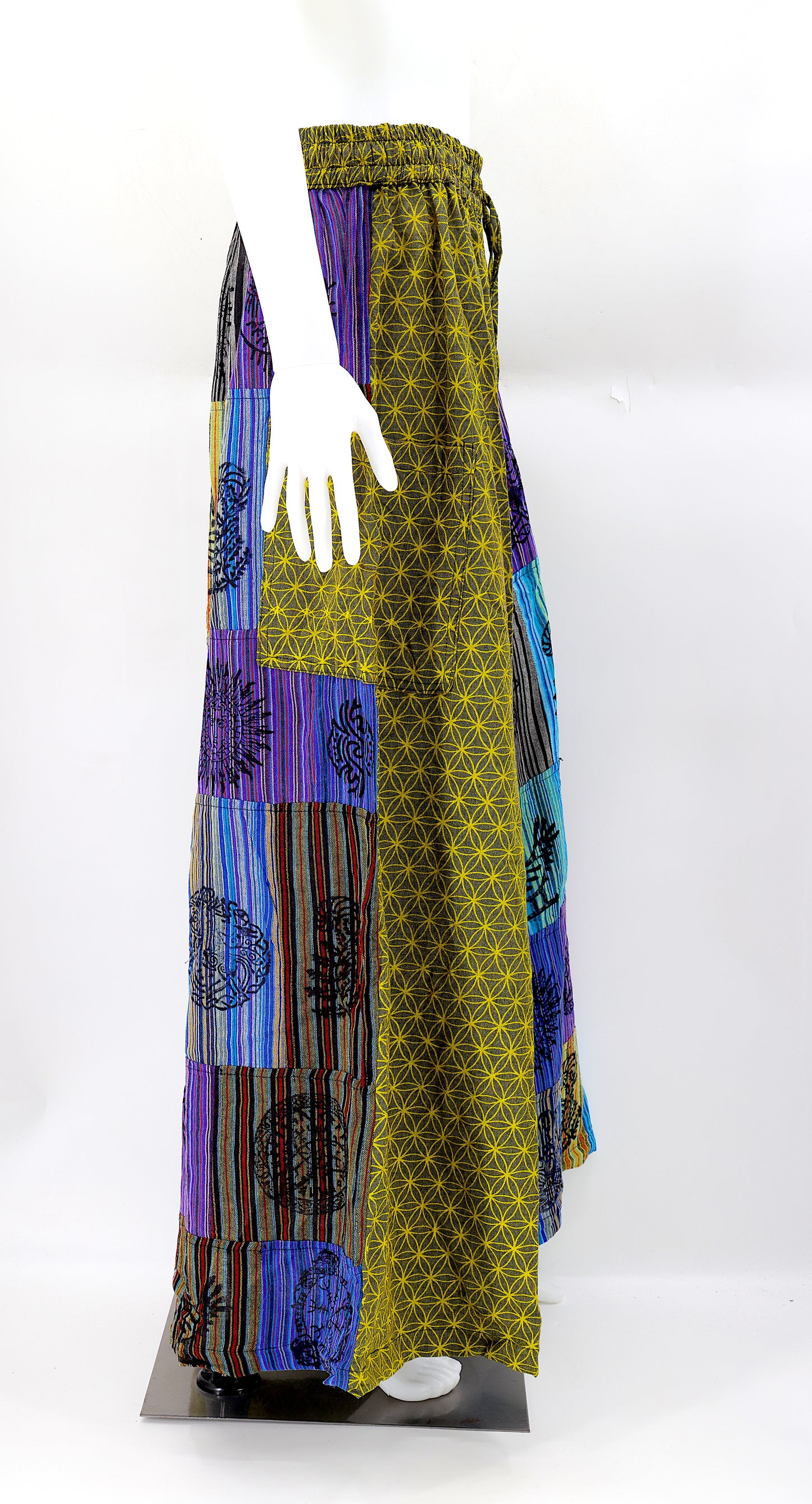 Side view showing adjustable waistband and large pockets on handmade bohemian wide-leg pants