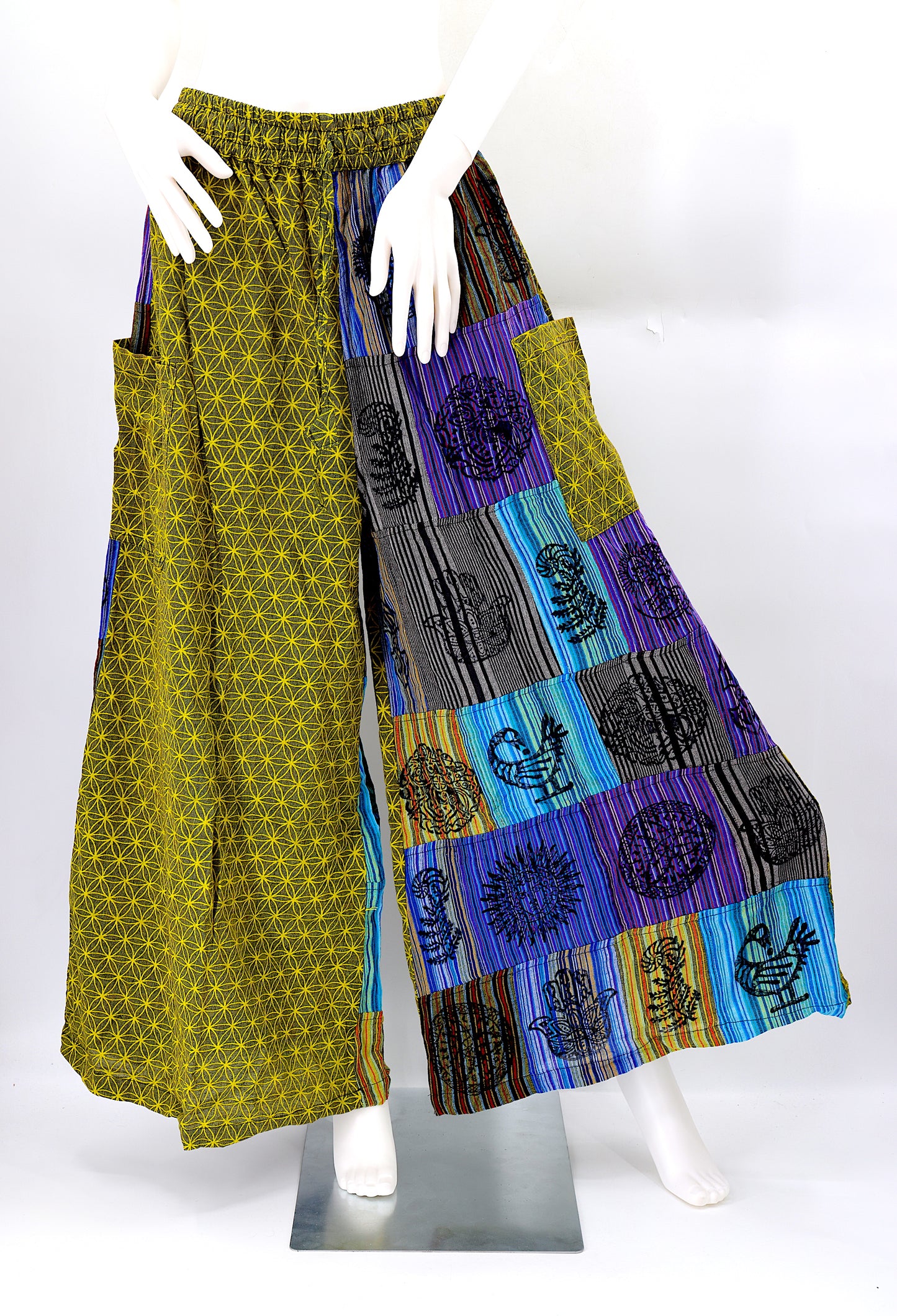 Front view of handmade Flower of Life patchwork wide-leg harem pants with pagan symbol block prints