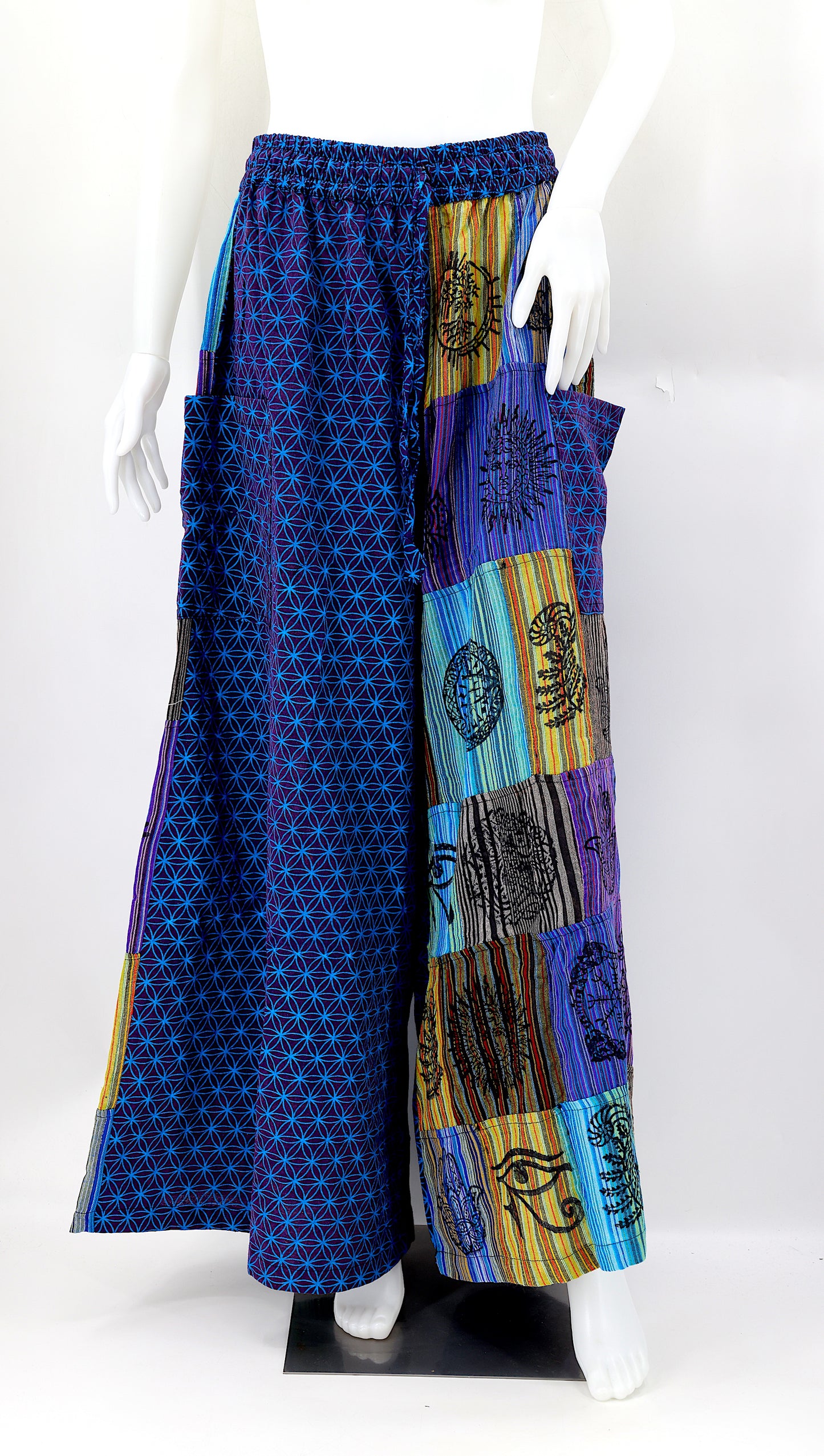Front view of handmade Flower of Life patchwork wide-leg harem pants with pagan symbol block prints