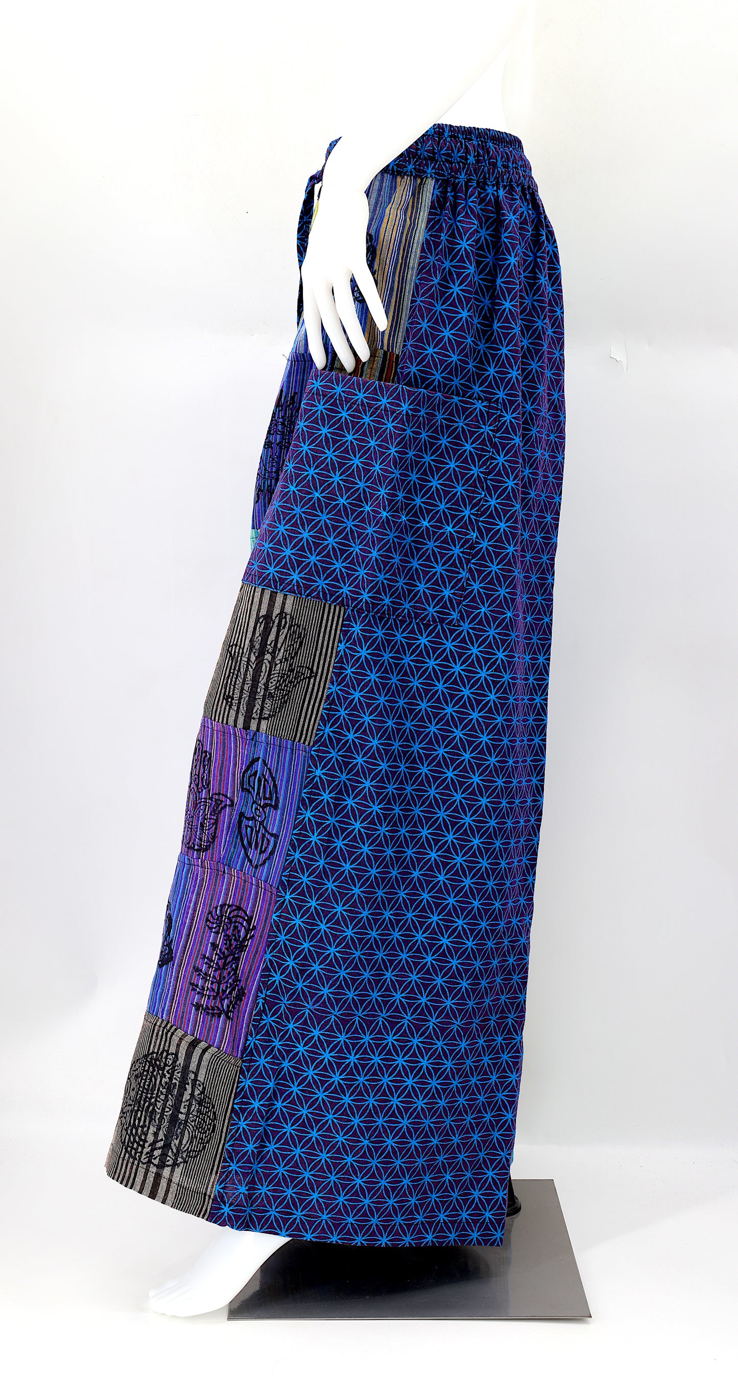 Side view showing adjustable waistband and large pockets on handmade bohemian wide-leg pants