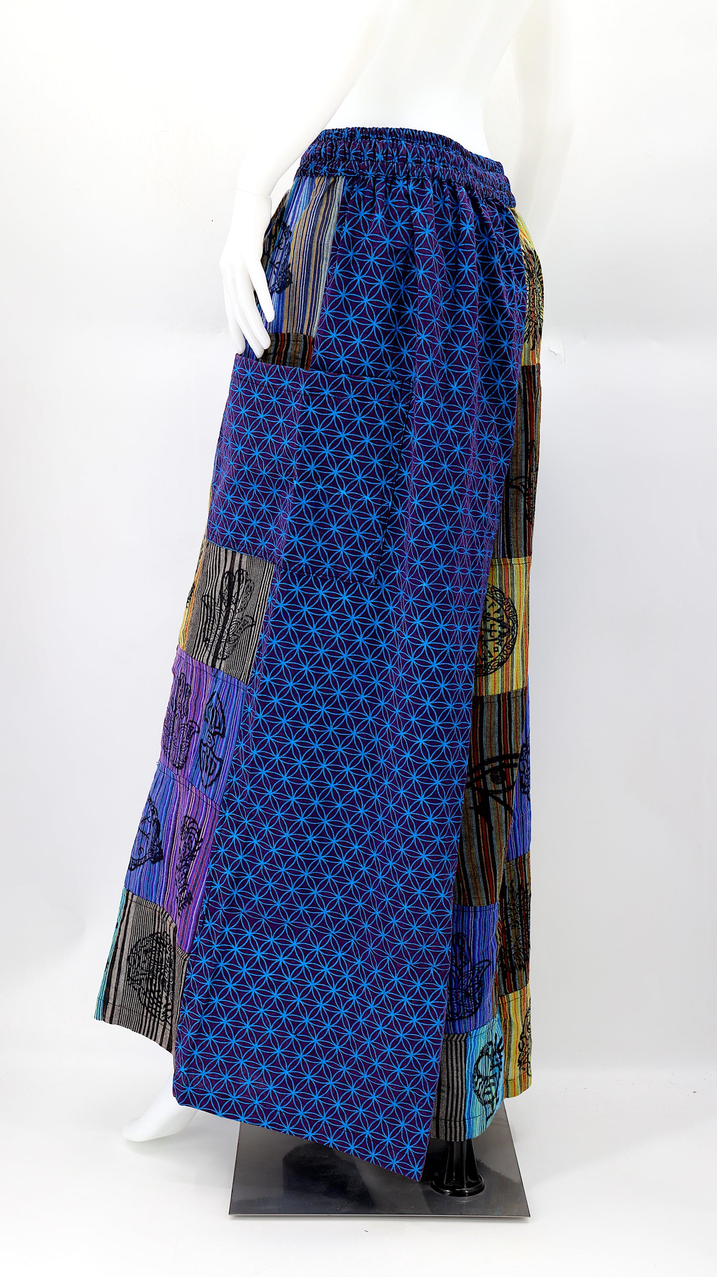 Back view of unique patchwork design featuring pagan symbols on wide-leg cotton harem trousers