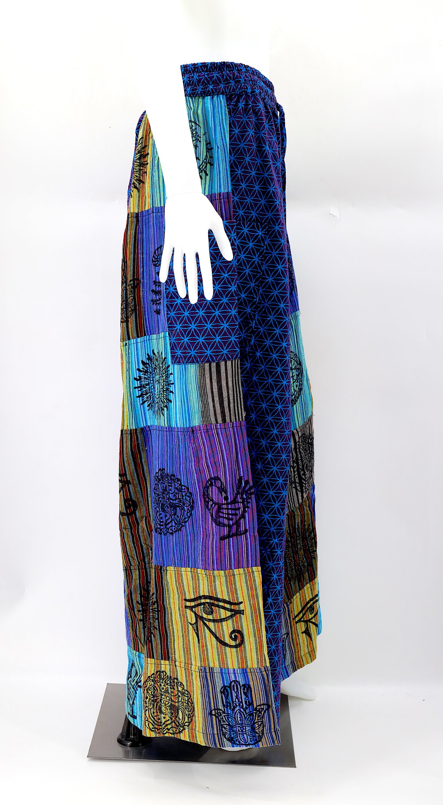 Side view showing adjustable waistband and large pockets on handmade bohemian wide-leg pants