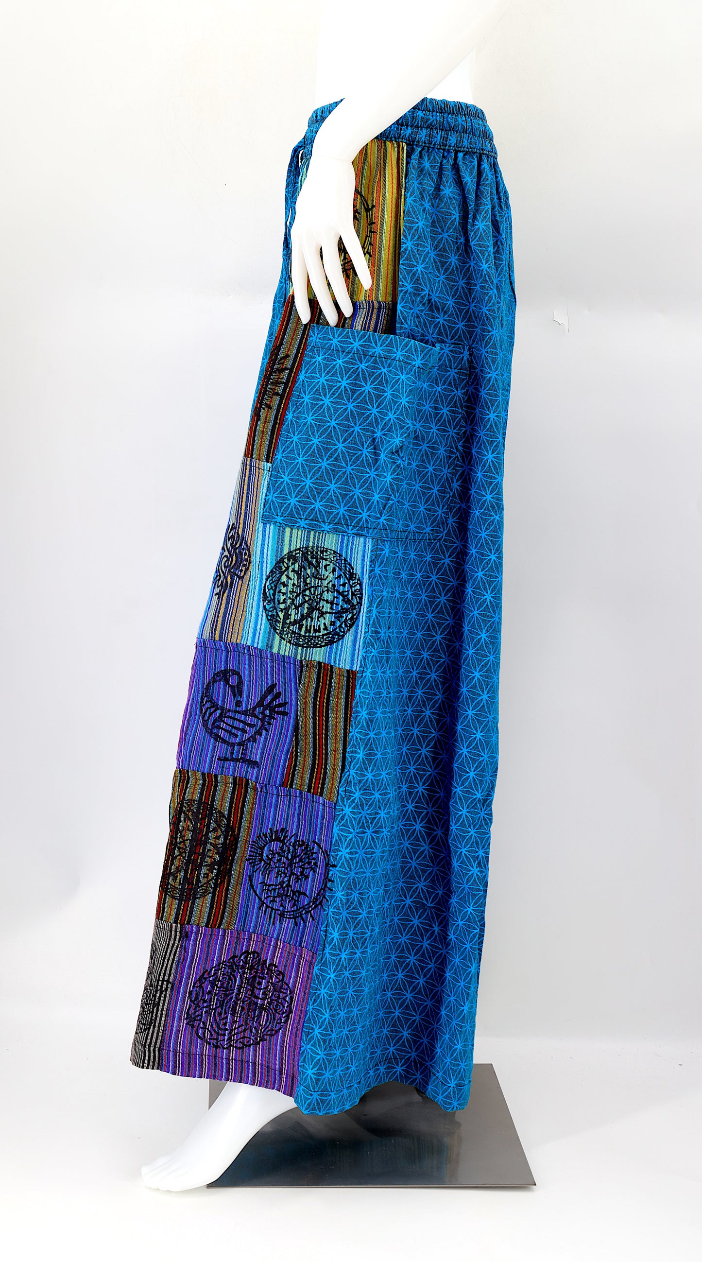 Side view showing adjustable waistband and large pockets on handmade bohemian wide-leg pants