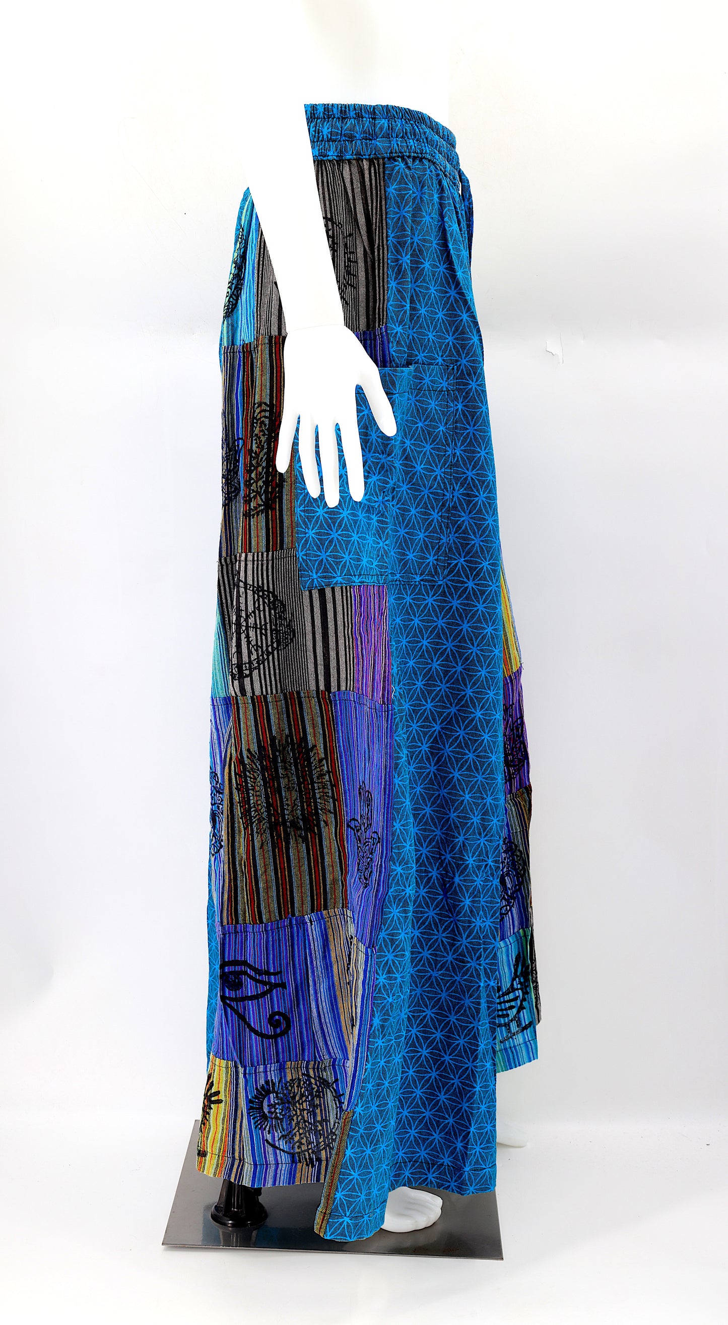 Side view showing adjustable waistband and large pockets on handmade bohemian wide-leg pants