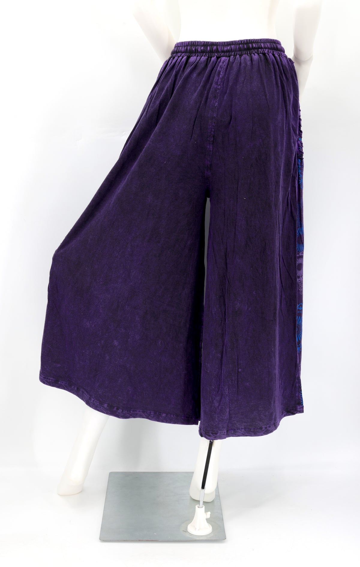 Back view of Himalayan handmade cotton trousers with natural embroidery pattern.