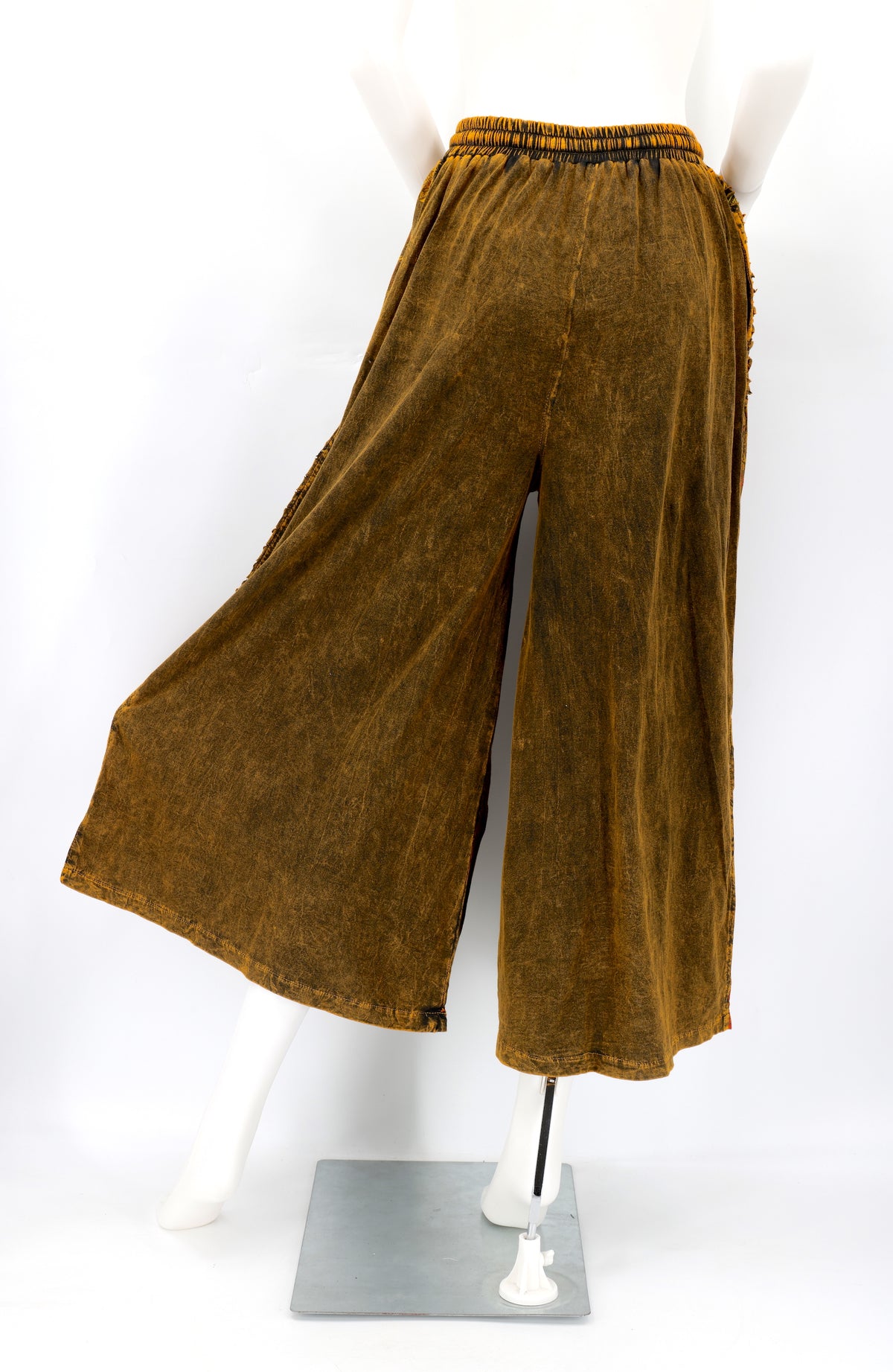 Back view of Himalayan handmade cotton trousers with natural embroidery pattern.
