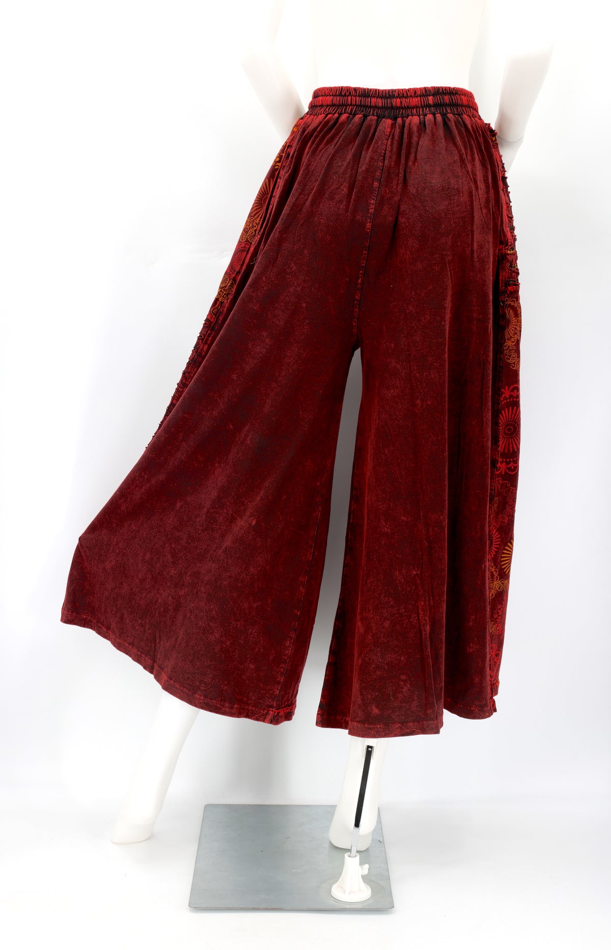 Back view of Himalayan handmade cotton trousers with natural embroidery pattern.