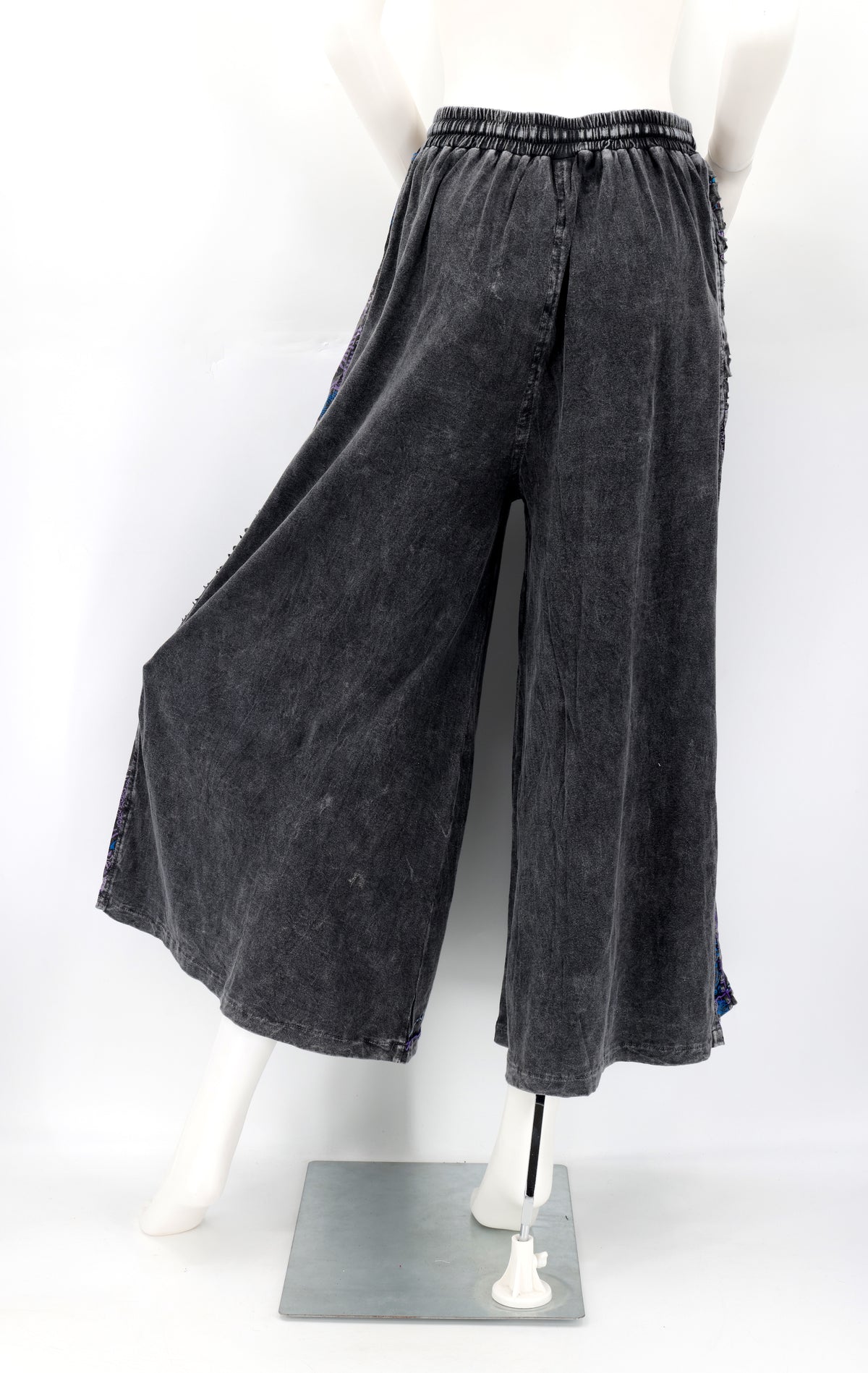 Back view of Himalayan handmade cotton trousers with natural embroidery pattern.
