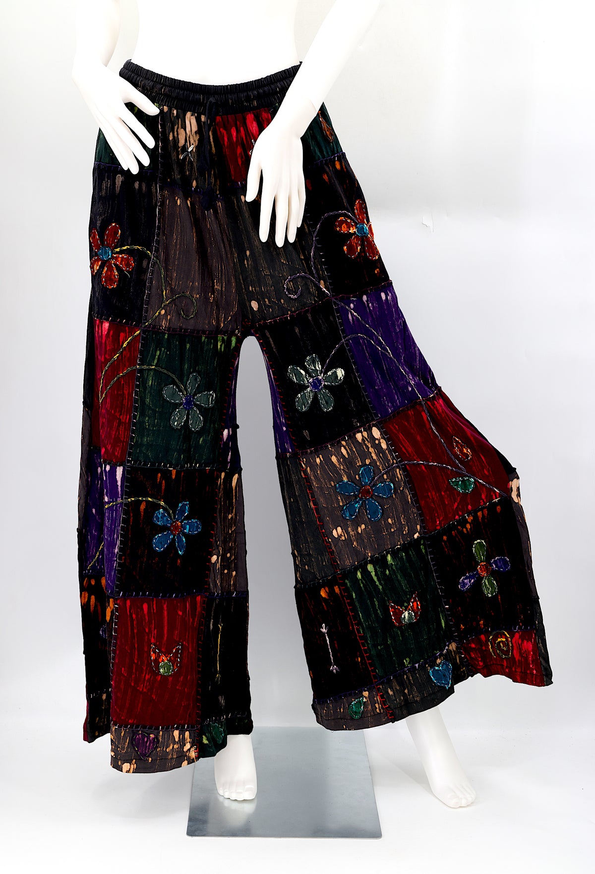 Front view of lightweight handmade flower embroidered cotton harem pants
