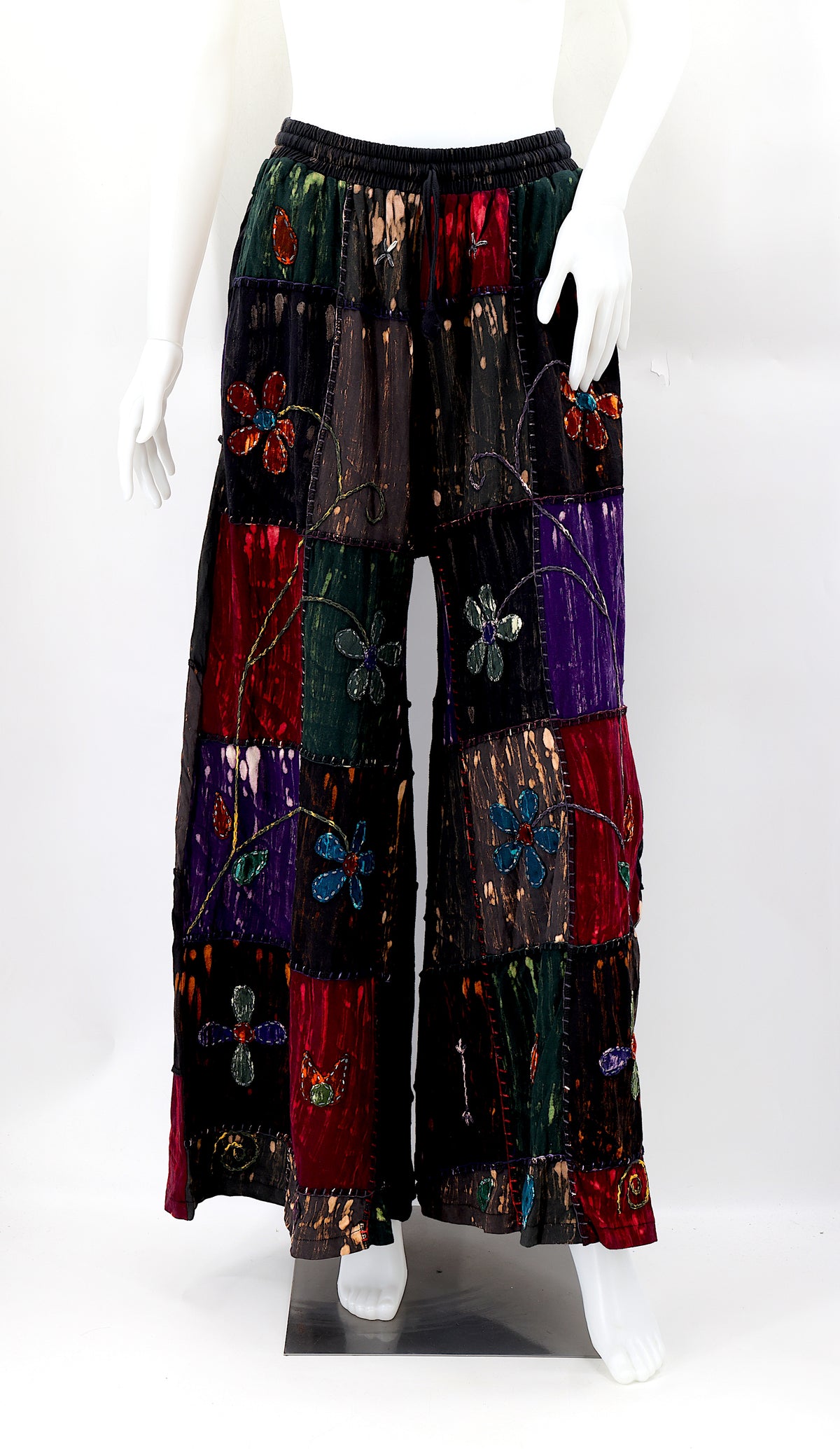Front view of lightweight handmade flower embroidered cotton harem pants