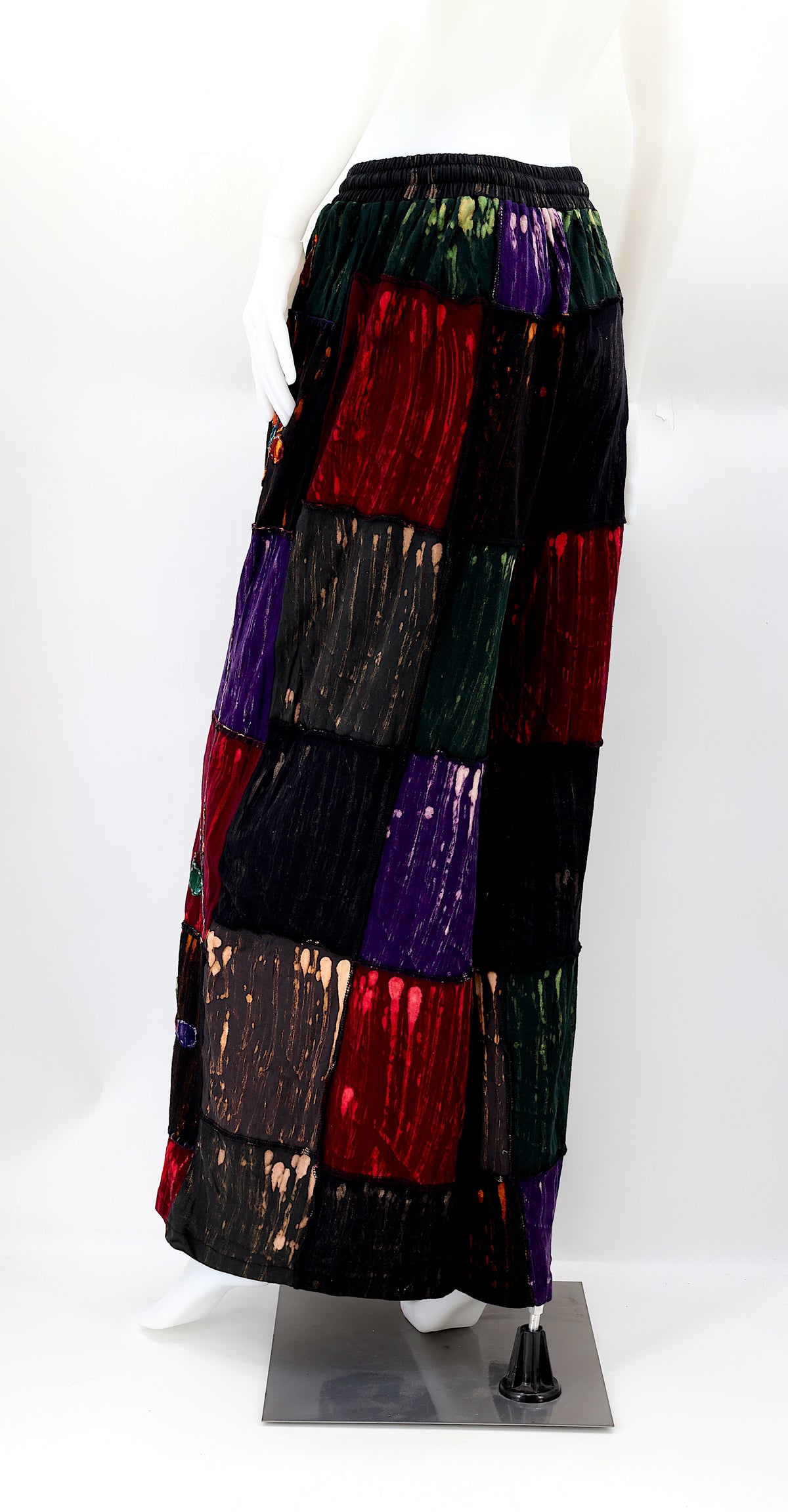 Rear view of relaxed fit flower patchwork pants with elastic waistband