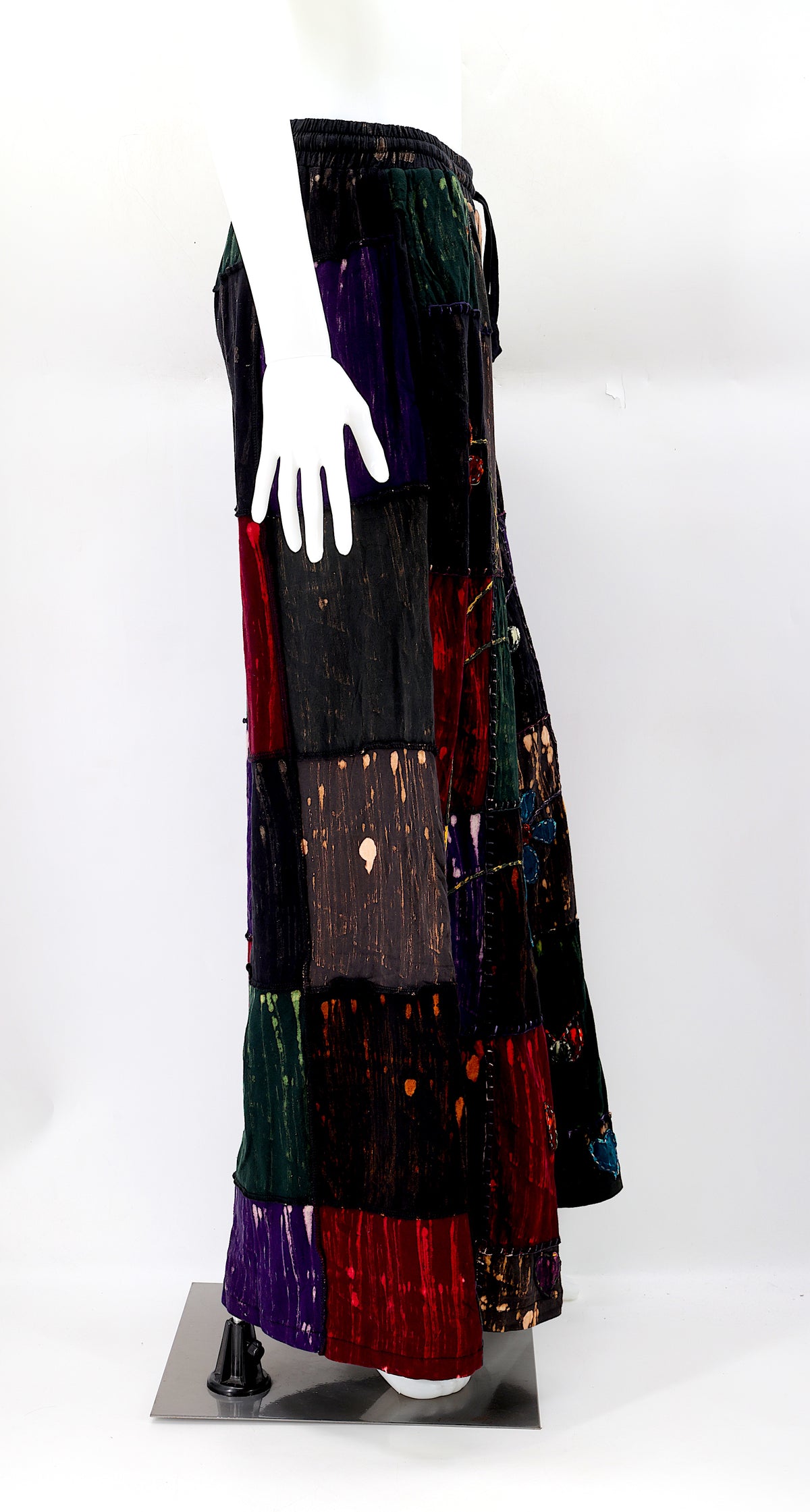 Side view showing wide-leg fit and deep pockets of boho harem pants