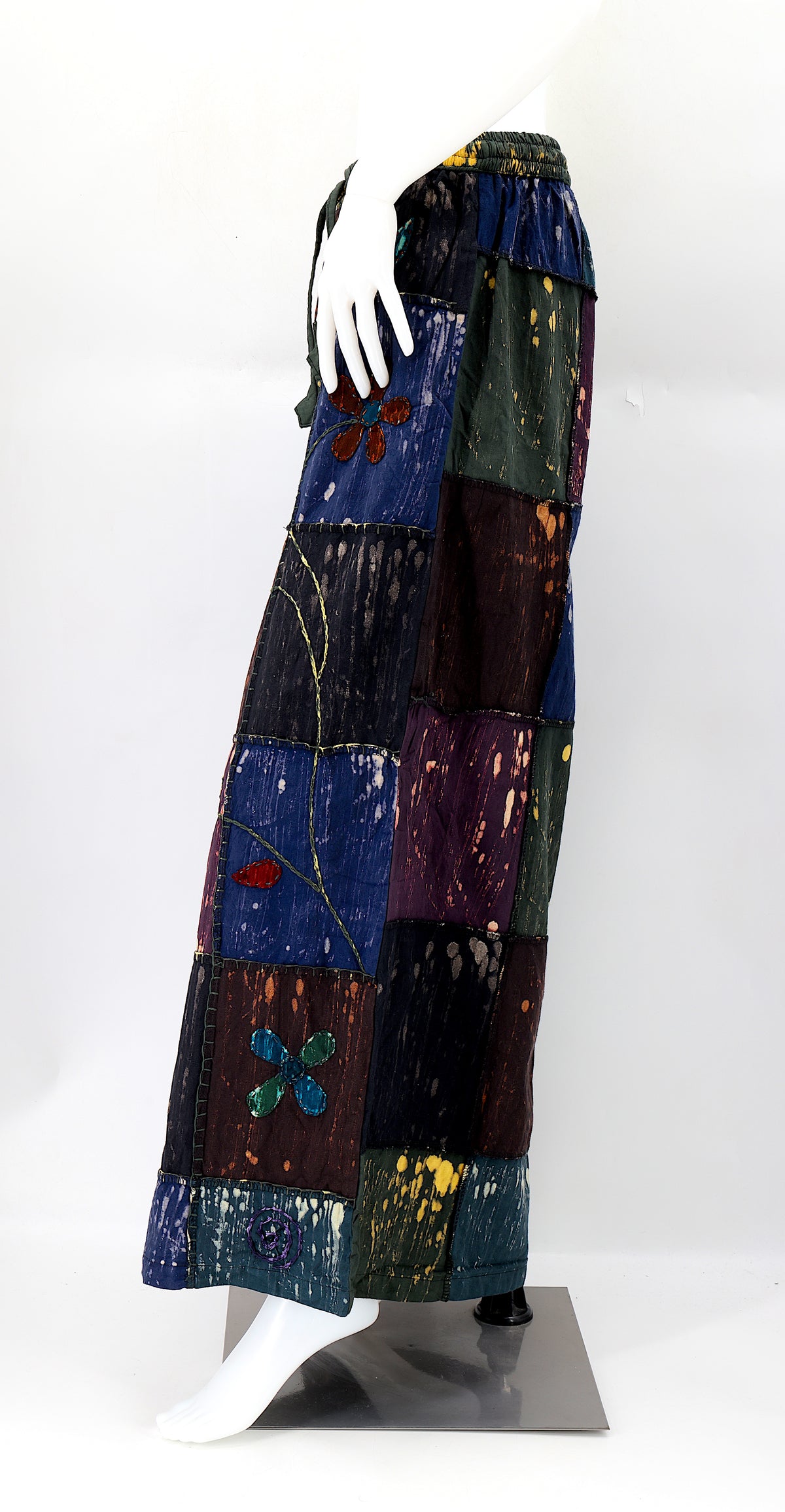 Side view showing adjustable elastic waistband and large pockets on handmade cotton pants