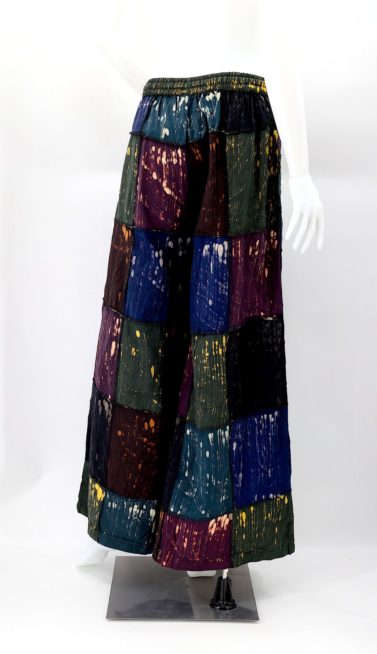 Back view of unique flower embroidered patchwork design on wide-leg boho trousers