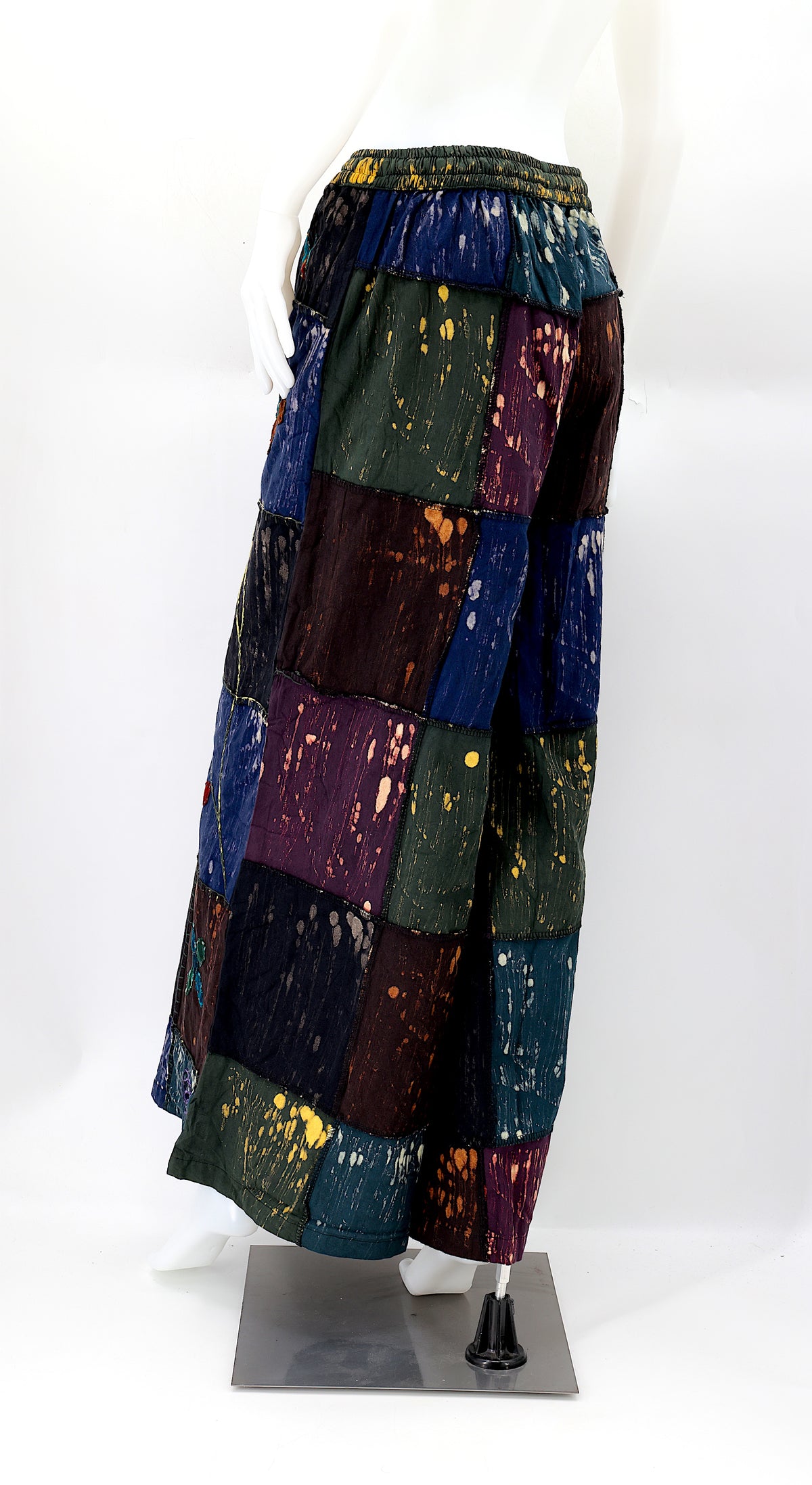 Back view of unique flower embroidered patchwork design on wide-leg boho trousers