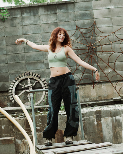 Model wearing boho-style harem pants in outdoor natural setting