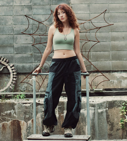 Model wearing boho-style harem pants in outdoor natural setting
