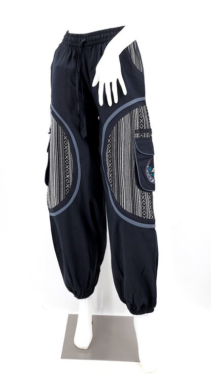 Front view of handmade moon and mushroom embroidered straight-leg harem pants