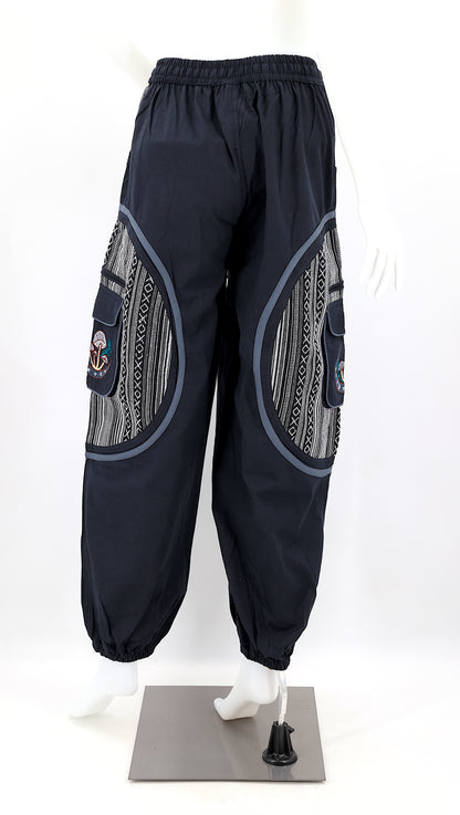 Back view of handmade moon and mushroom embroidered straight-leg harem pants