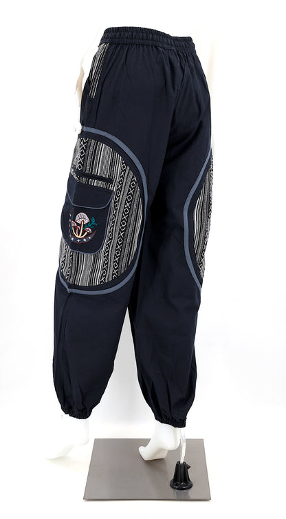 Back view of handmade moon and mushroom embroidered straight-leg harem pants