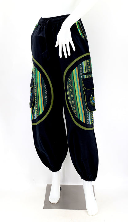 Front view of handmade moon and mushroom embroidered straight-leg harem pants