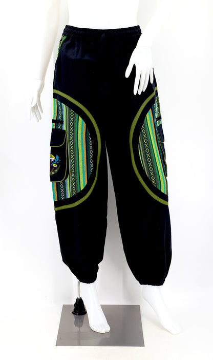 Front view of handmade moon and mushroom embroidered straight-leg harem pants