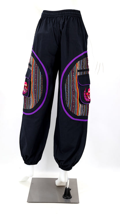 Back view of handmade moon and mushroom embroidered straight-leg harem pants