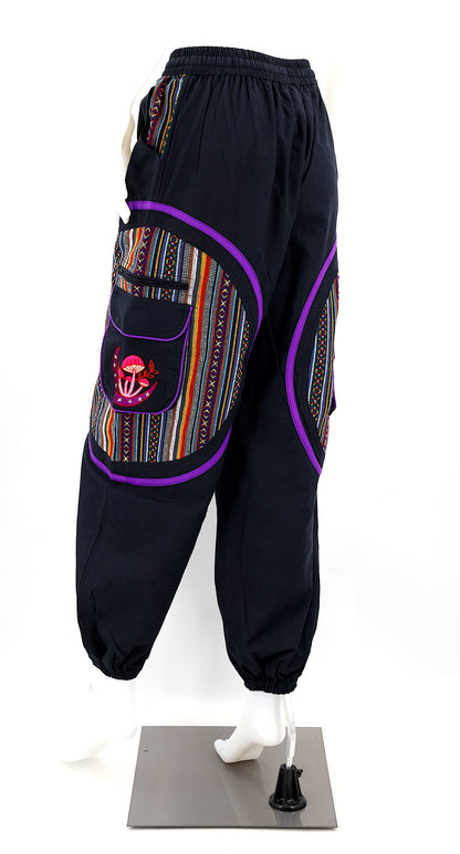 Back view of handmade moon and mushroom embroidered straight-leg harem pants