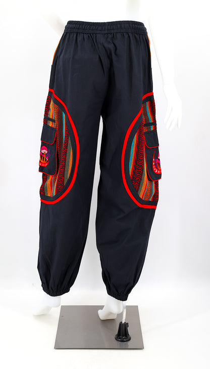 Back view of handmade moon and mushroom embroidered straight-leg harem pants