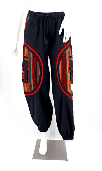 Front view of handmade moon and mushroom embroidered straight-leg harem pants