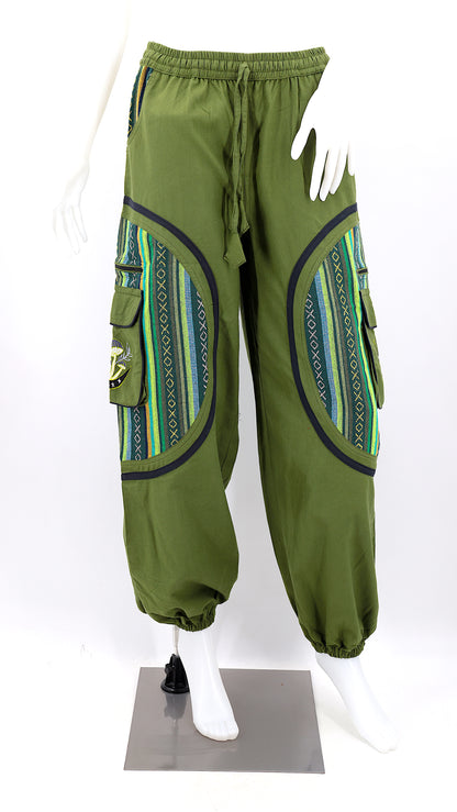 Front view of green handmade moon and mushroom embroidered straight-leg harem pants