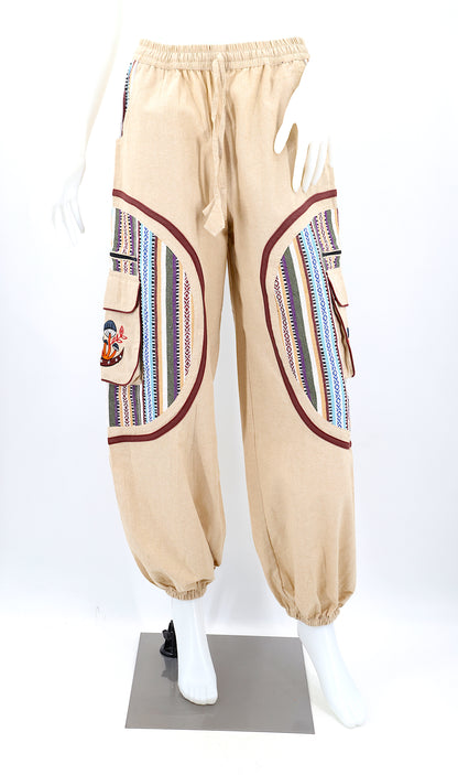 Front view of handmade moon and mushroom embroidered straight-leg harem pants