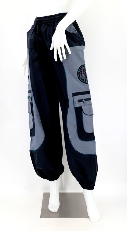 Close-up of black gray embroidered Flower of Life symbol on handmade trousers