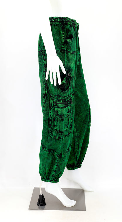 Side view showing relaxed fit and pocket detail of dark green boho harem trousers