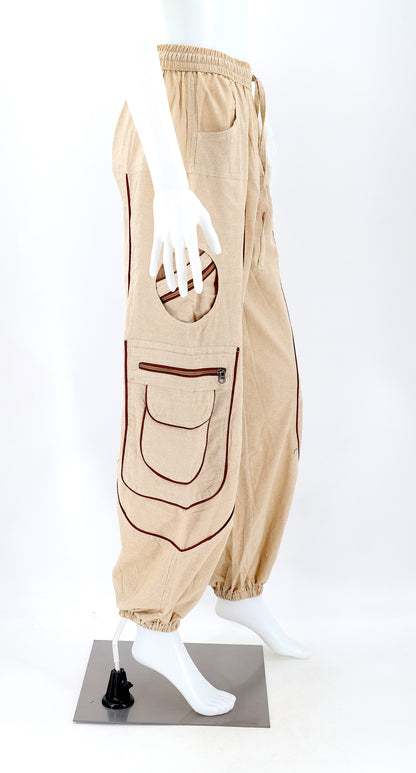 Side view showing relaxed fit and pocket detail of beige boho harem trousers