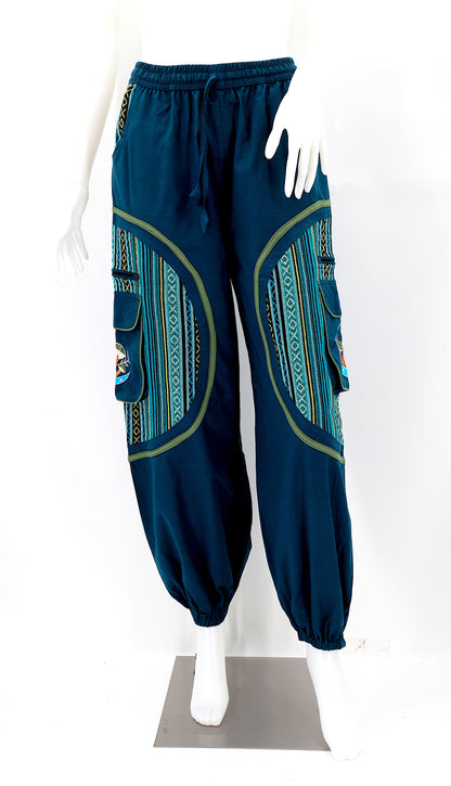 Front view of handmade moon and mushroom embroidered straight-leg harem pants