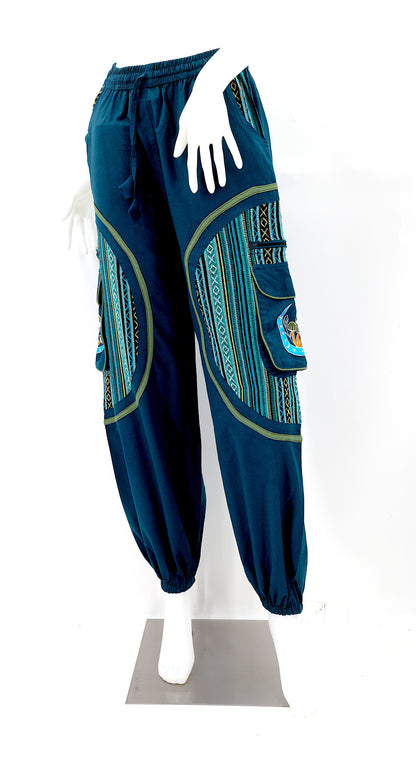 Front view of handmade moon and mushroom embroidered straight-leg harem pants