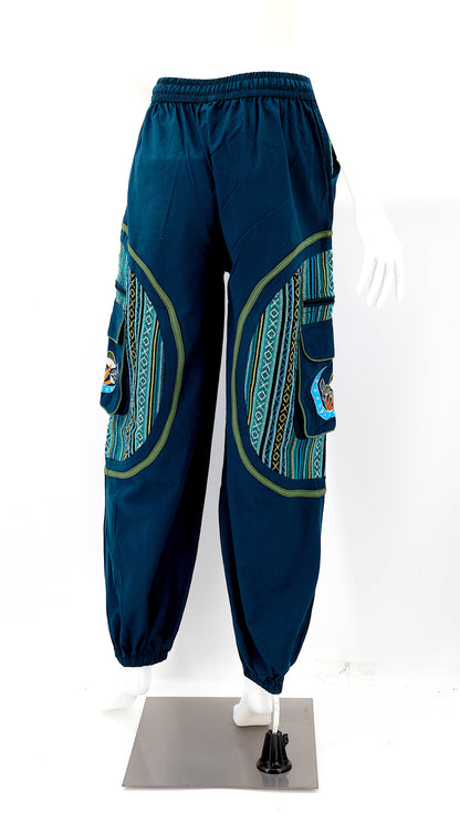 Back view of handmade moon and mushroom embroidered straight-leg harem pants