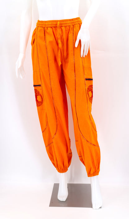 Front view of orange handmade Tree of Life embroidered straight-leg harem pants