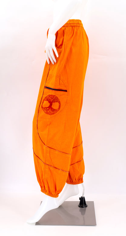 Orange side view highlighting secure zippered and buttoned pockets