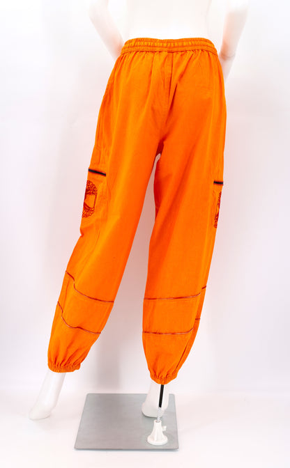 Back view of orange handmade Tree of Life embroidered straight-leg harem pants