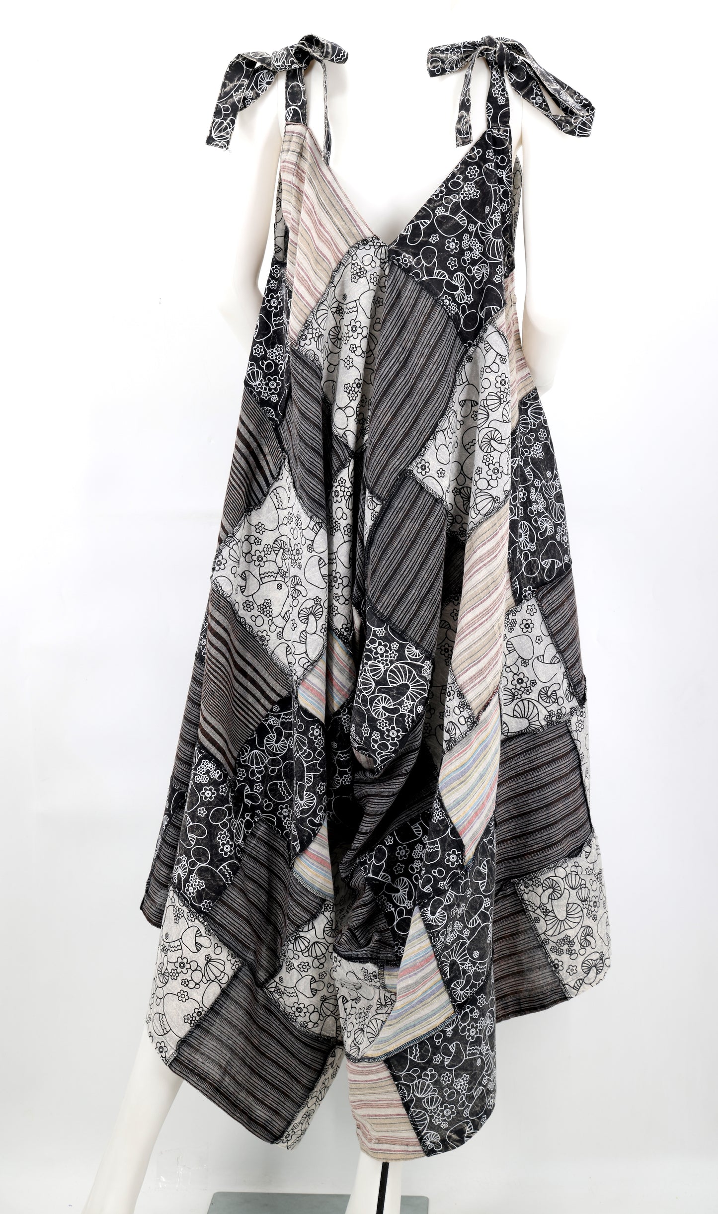 Black and white patterned dress on a mannequin against a white background