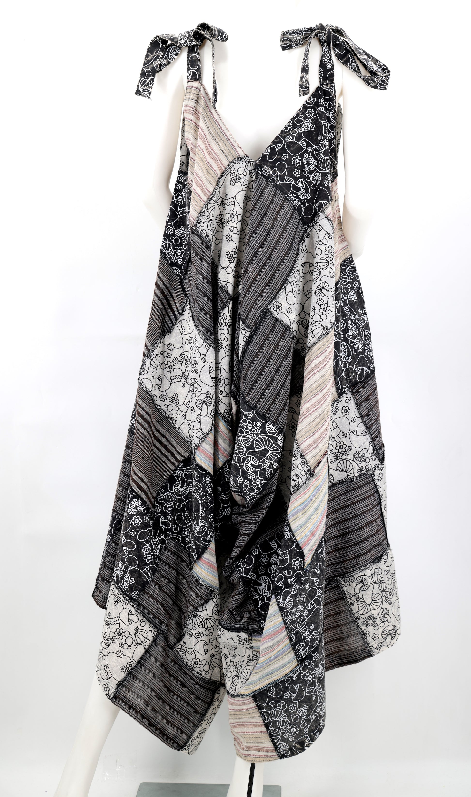 Black and white patterned dress on a mannequin against a white background