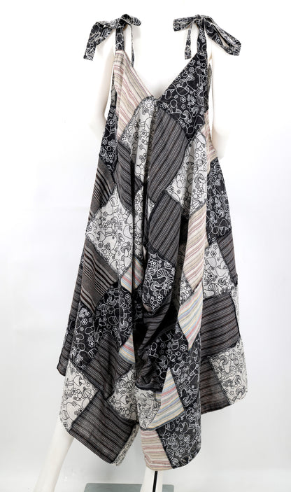 Black and white patterned dress on a mannequin against a white background