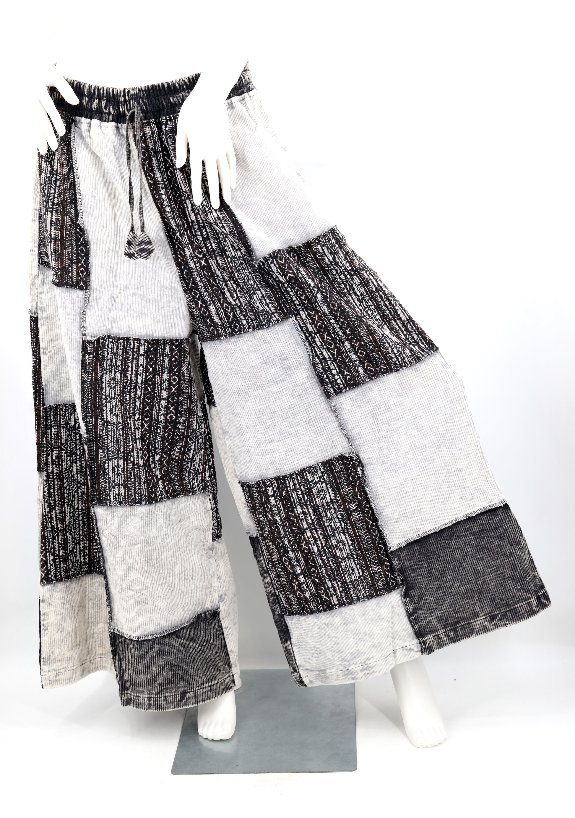 Patchwork pants on a mannequin against a white background