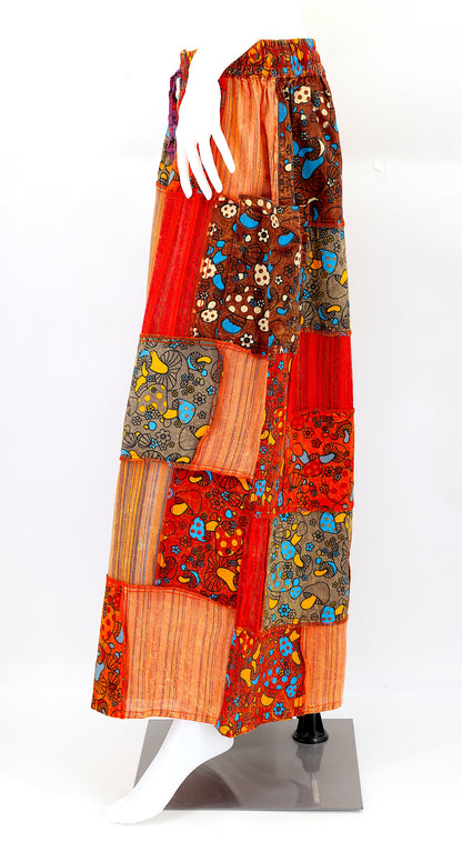 Side view of bohemian wide-leg harem pants featuring colorful mushroom patches and large pocket
